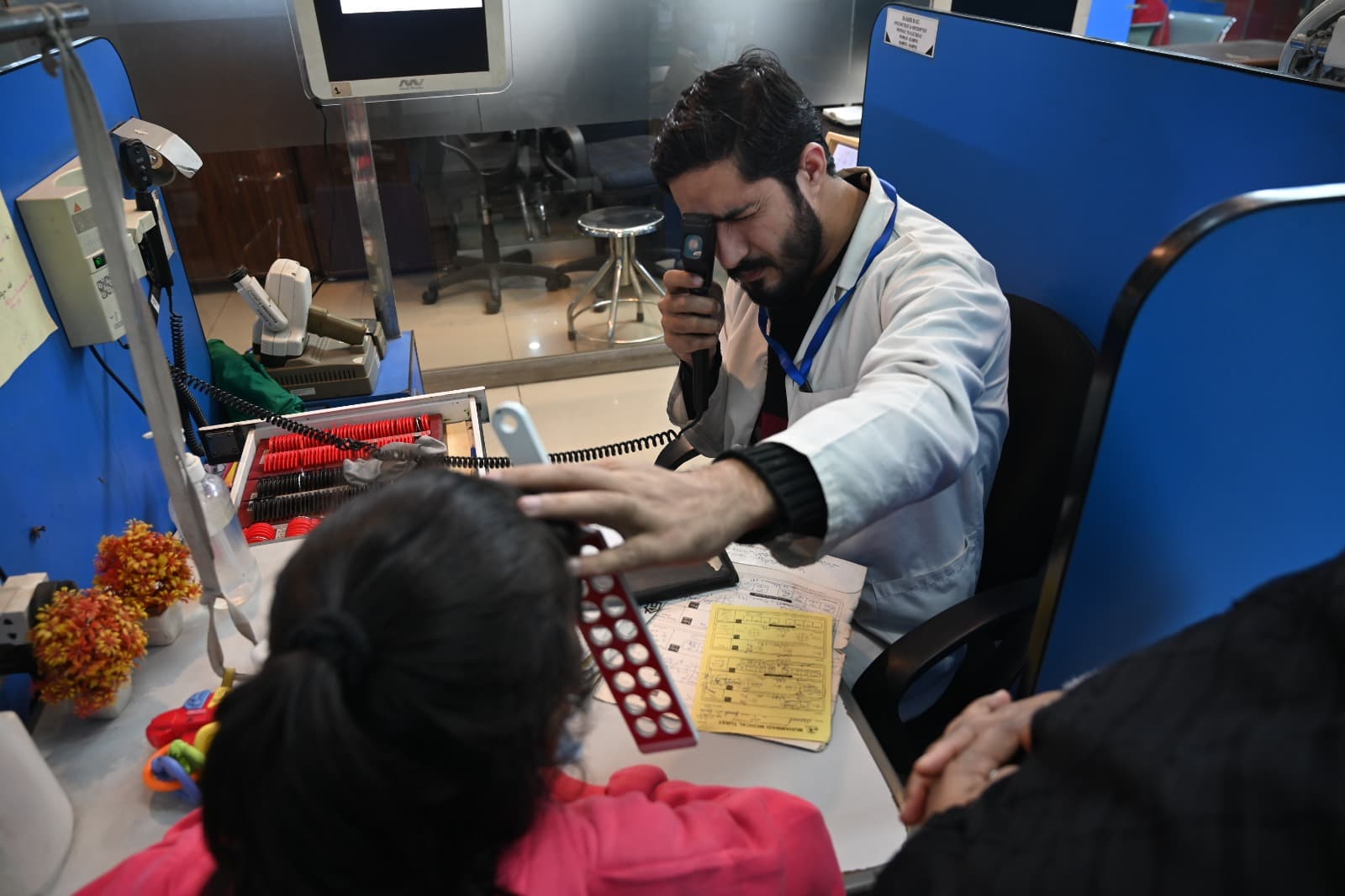 Clinician performing an eye examination