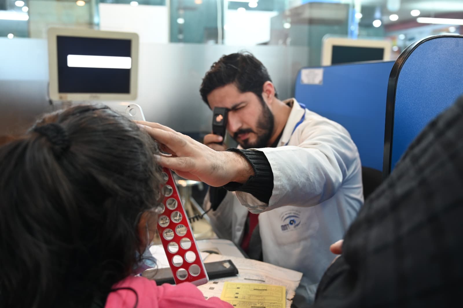 Clinician examining a patient at Muhammadi Medical Foundation